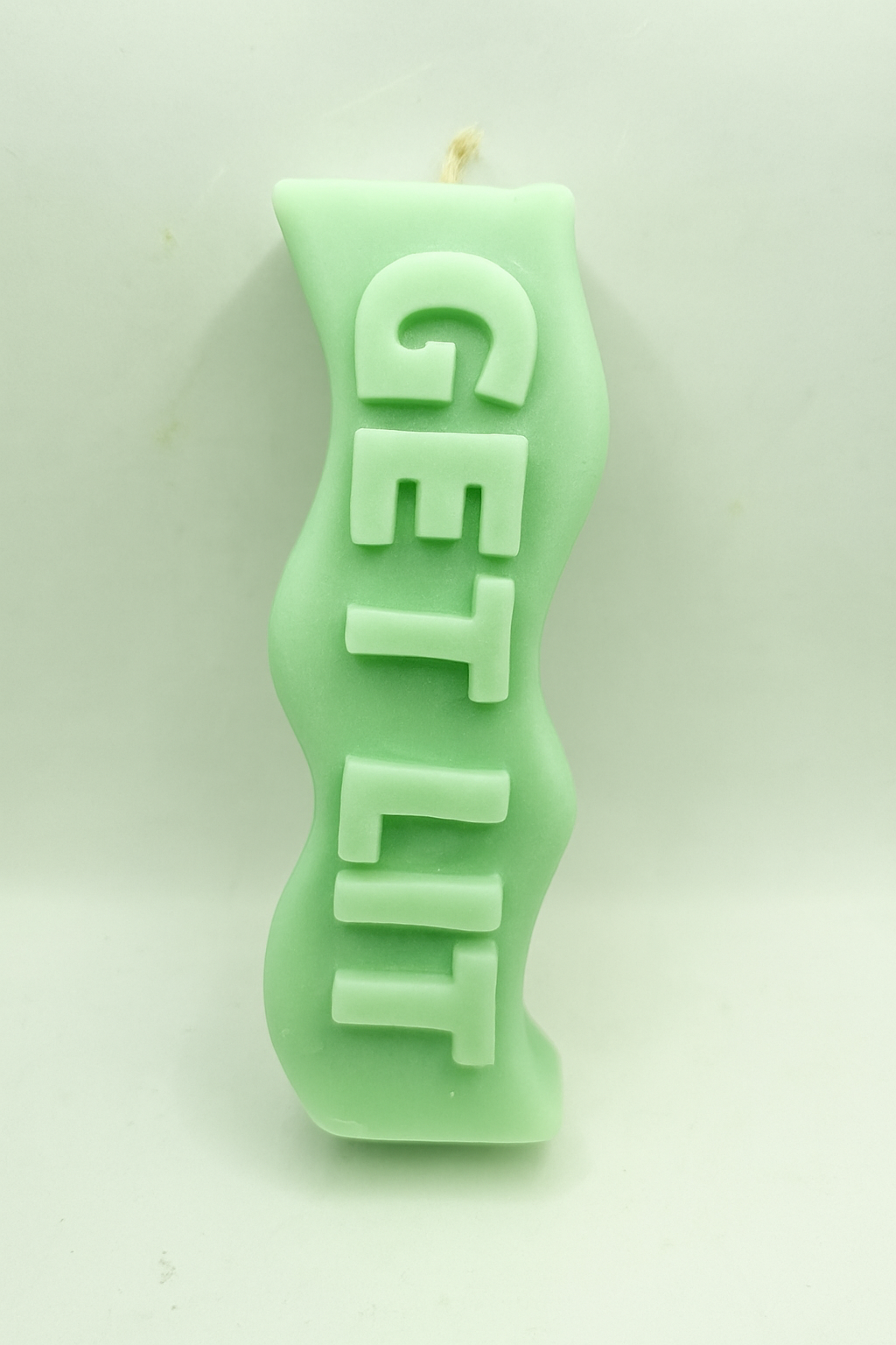 Green Get Lit Candle with playful quote and eucalyptus mint scent in vibrant green design