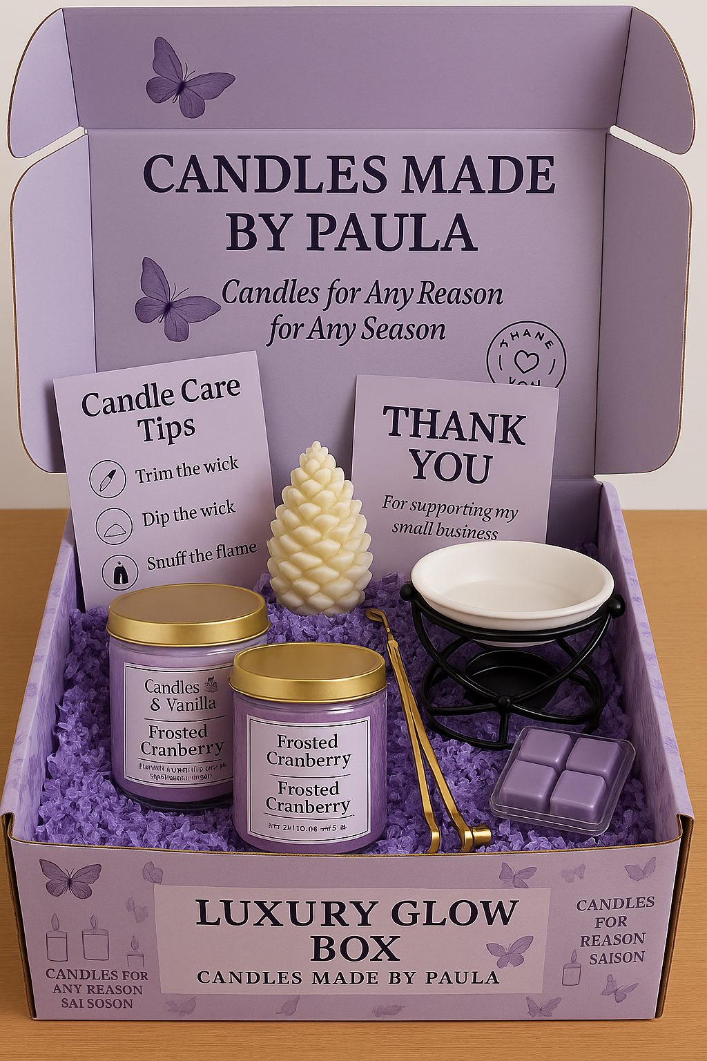 Luxury Glow Box featuring luxury candles, sculpted seasonal candle, wax melts, and candle care set in elegant gift packaging