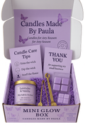 Mini Glow Box with luxury tin candles, wax melt pack, metal burner, candle care set, and instruction card for self-care and relaxation