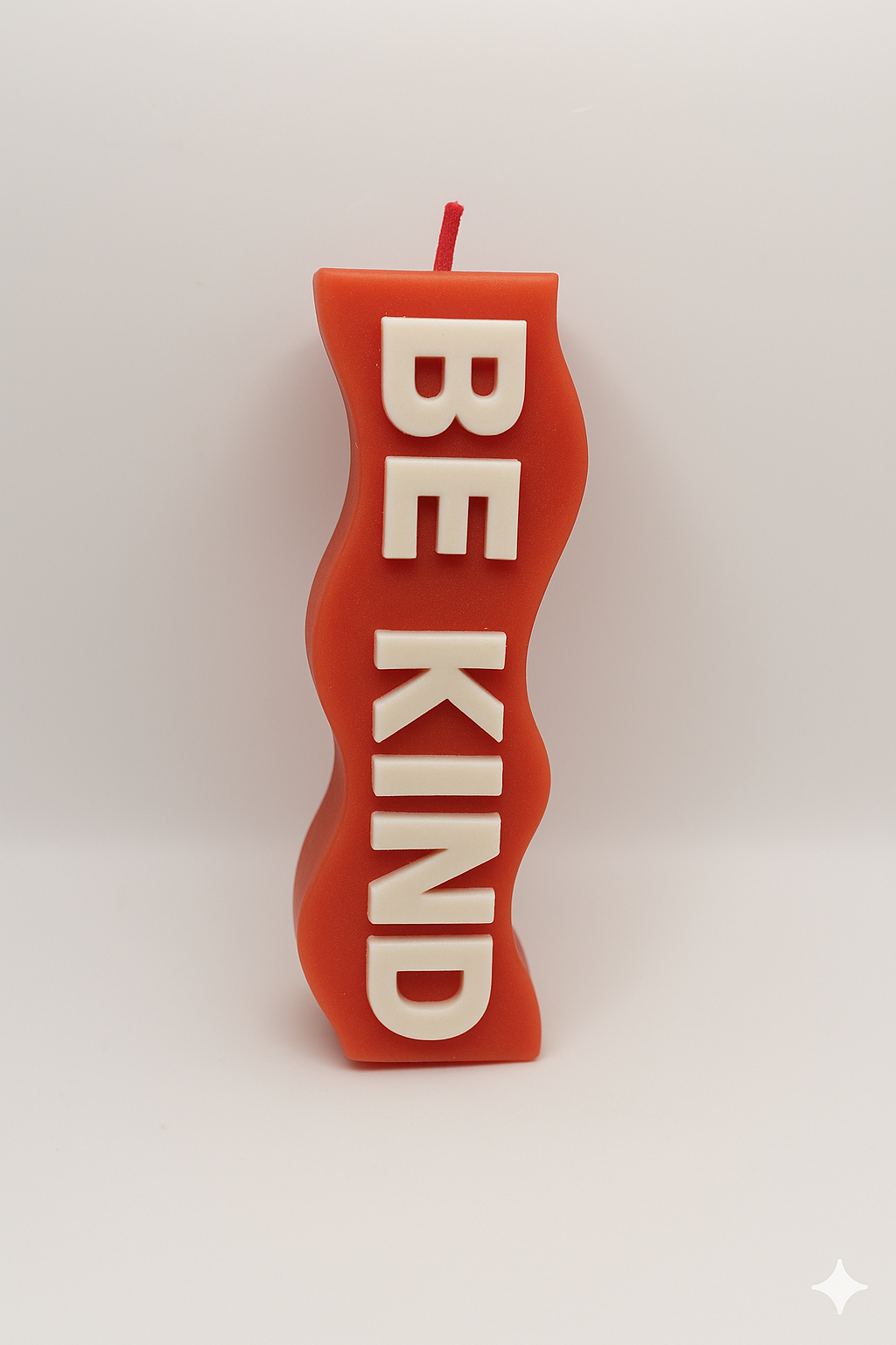 Red Be Kind Candle with heartwarming cinnamon scent and inspirational "Be Kind" message in red decor candle