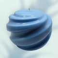 Blue Swirl Candle with hand-poured soy wax and calming coastal swirl design